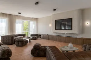 a work place with a desk and chair with wooden floor