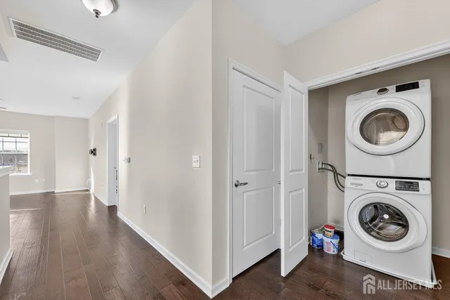 a view of a hallway with washer and dryer