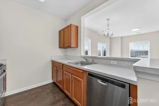 a kitchen with a sink and a refrigerator