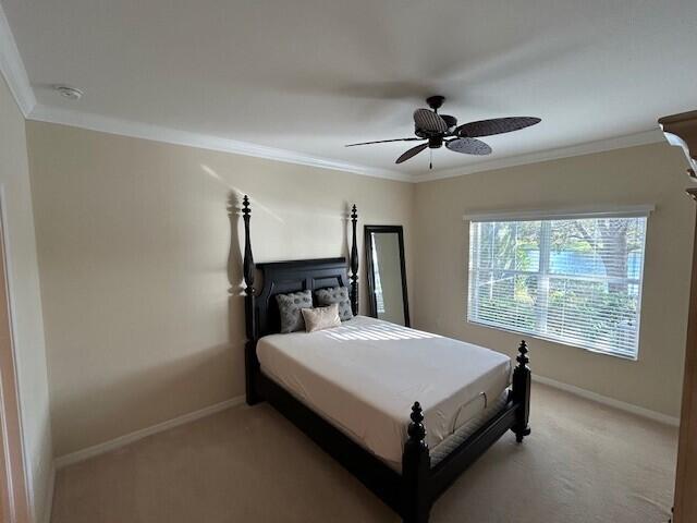 3551 Funston Circle Melbourne, FL 32940 - Photo 17 of 42 a bedroom with a bed and a chandelier
