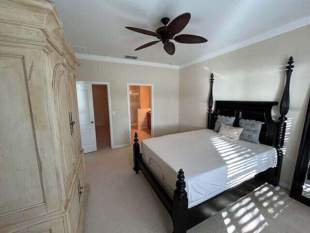3551 Funston Circle Melbourne, FL 32940 - Photo 18 of 42 a bedroom with a bed and a chandelier