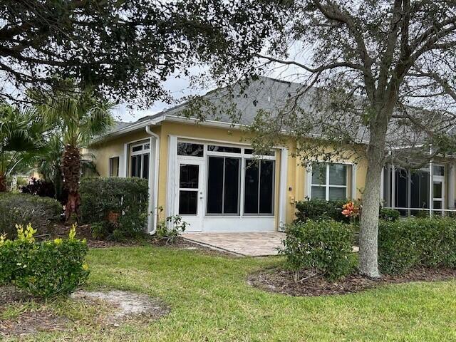 3551 Funston Circle Melbourne, FL 32940 - Photo 32 of 42 front view of a house with a yard
