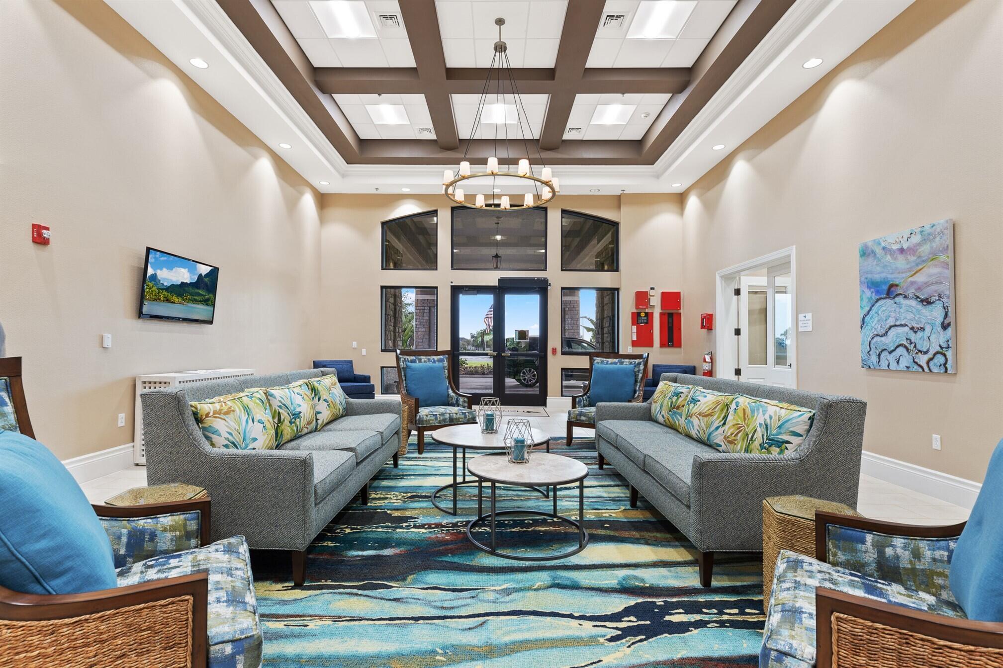 3551 Funston Circle Melbourne, FL 32940 - Photo 40 of 42 a living room with patio furniture and a chandelier