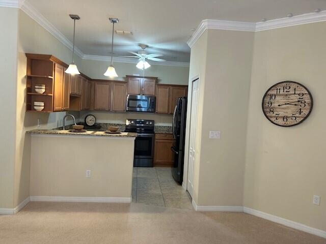 3551 Funston Circle Melbourne, FL 32940 - Photo 5 of 42 a kitchen with a refrigerator a stove and cabinets