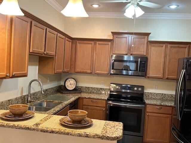 3551 Funston Circle Melbourne, FL 32940 - Photo 6 of 42 a kitchen with granite countertop a sink stainless steel appliances and cabinets