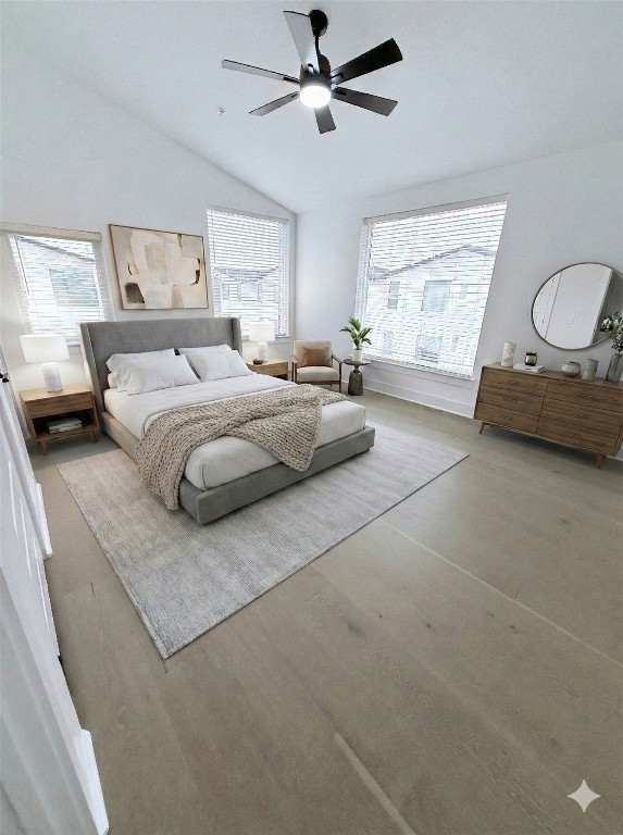 1417 Kramer Lane, Unit 20 Austin, TX 78758 - Photo 4 of 14 Bedroom with ceiling fan, wood finished floors, multiple windows, and high vaulted ceiling