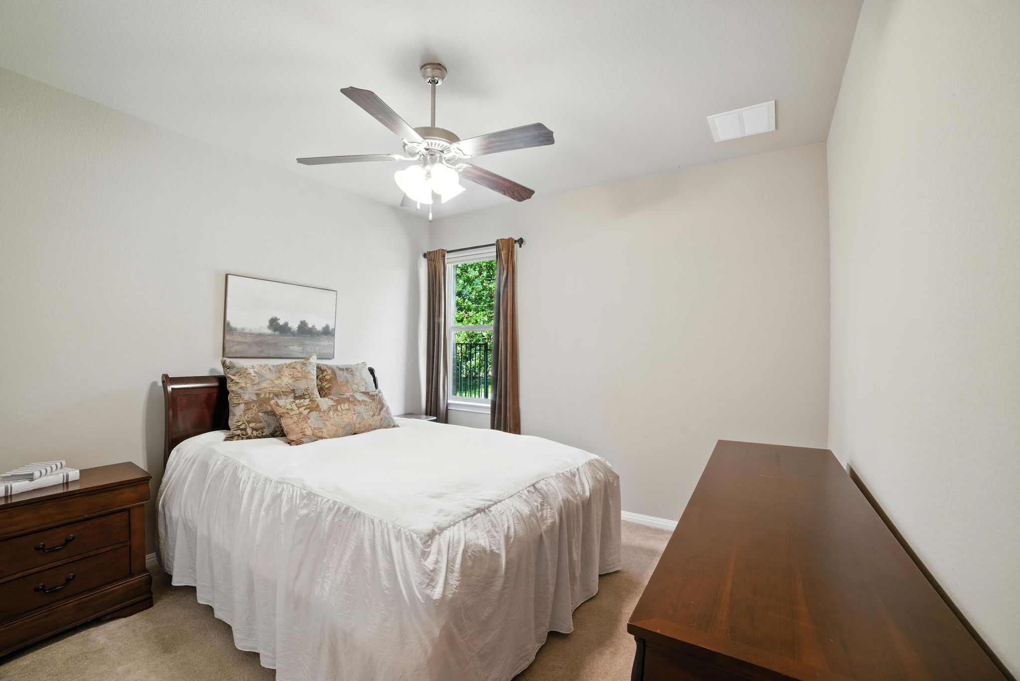 107 Tylee Circle Bastrop, TX 78602 - Photo 14 of 40 a bedroom with a bed and a window