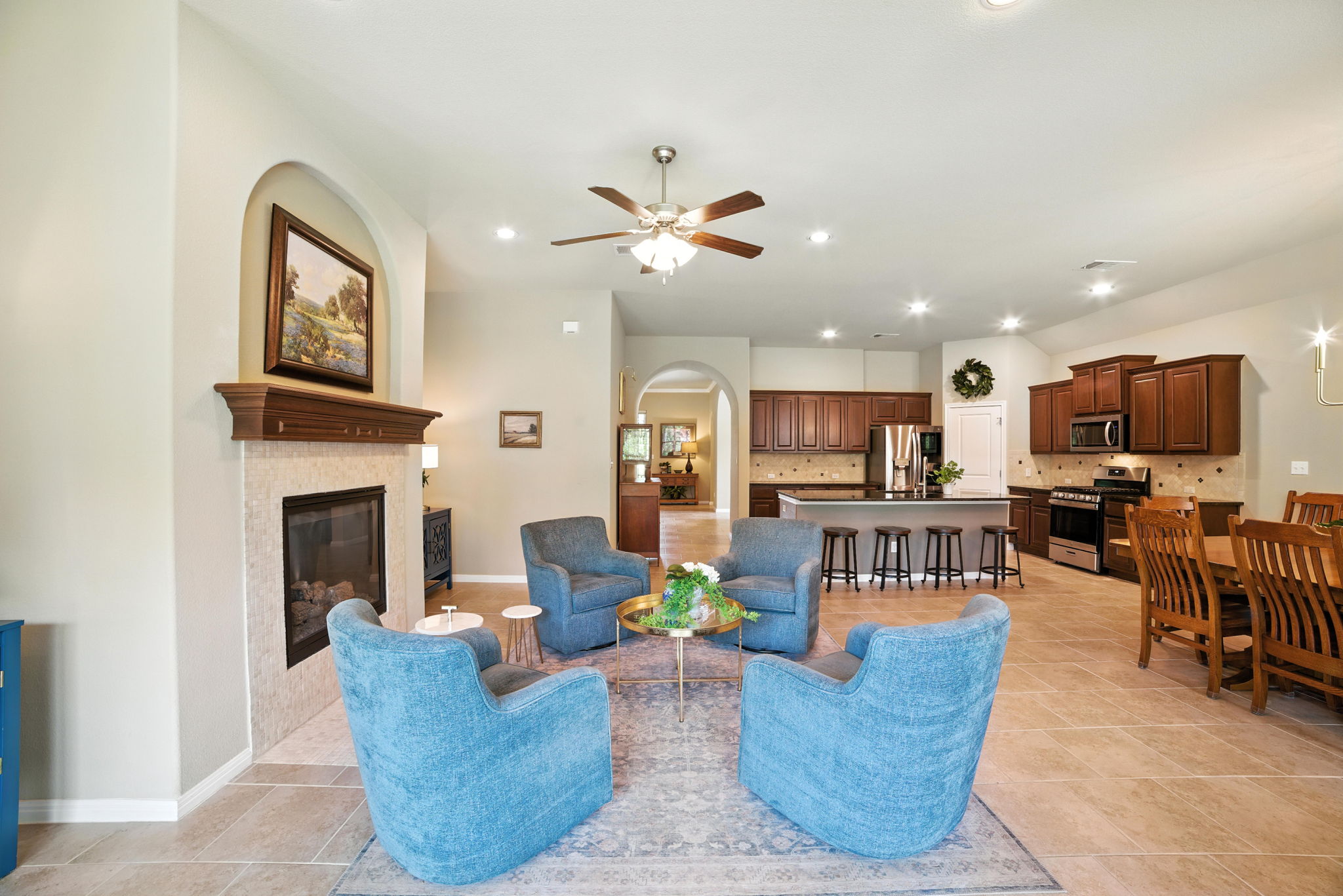 107 Tylee Circle Bastrop, TX 78602 - Photo 26 of 40 a living room with furniture a fireplace and a flat screen tv