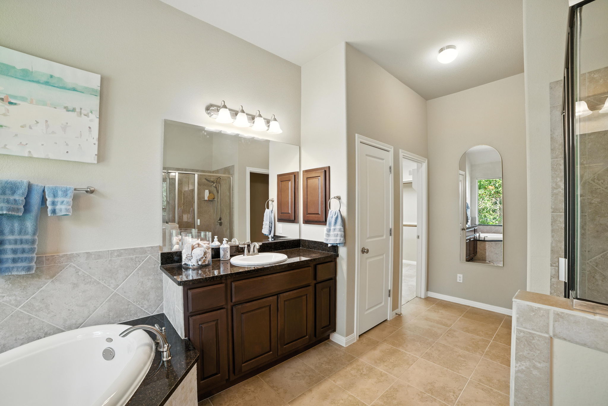 107 Tylee Circle Bastrop, TX 78602 - Photo 31 of 40 Full bathroom featuring vanity, a stall shower, a garden tub, and tile patterned floors