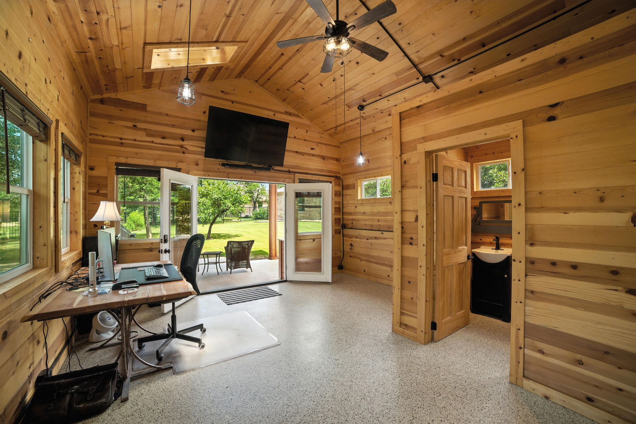 107 Tylee Circle Bastrop, TX 78602 - Photo 37 of 40 Office space featuring wooden ceiling, healthy amount of natural light, lofted ceiling, ceiling fan, and wooden walls