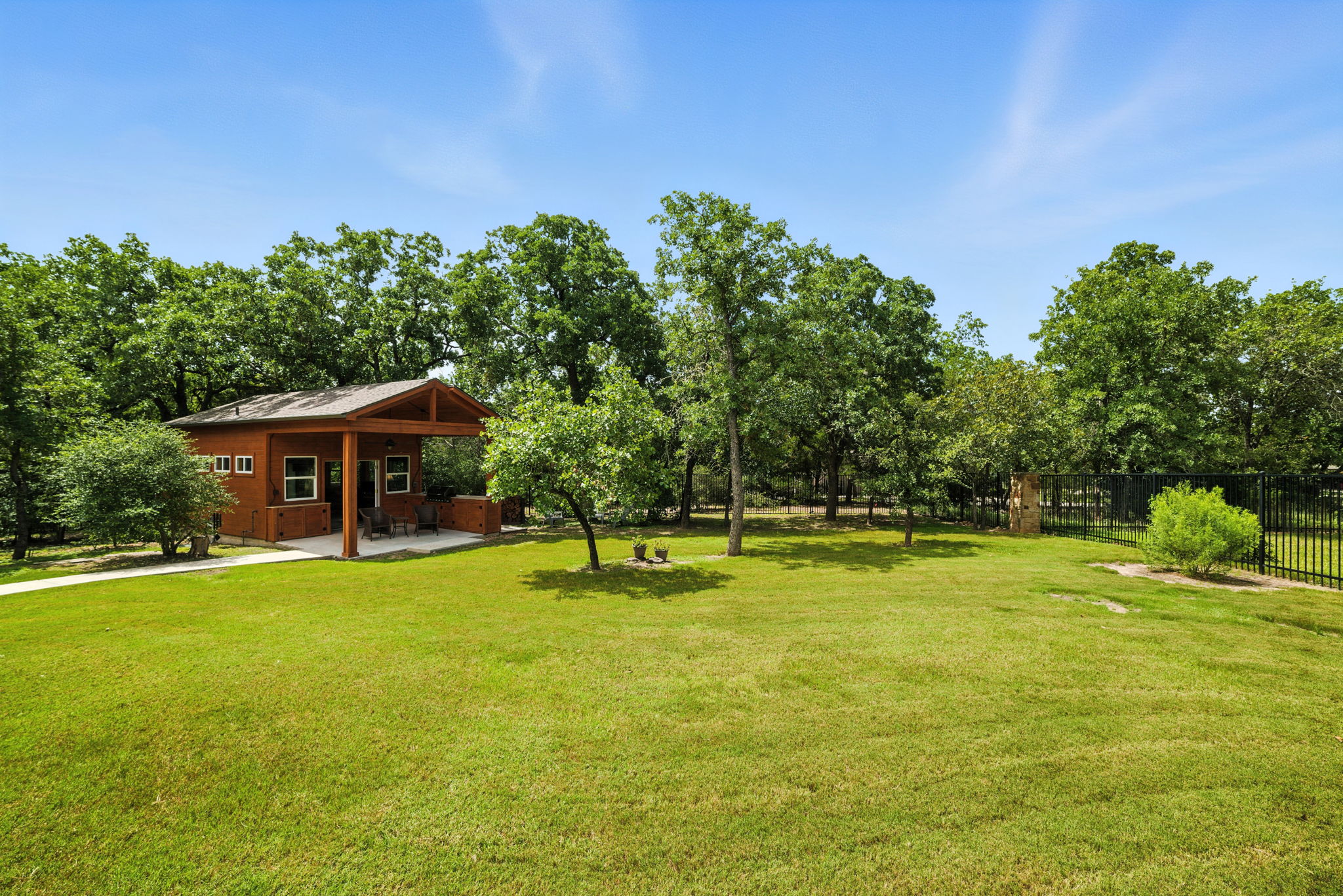 107 Tylee Circle Bastrop, TX 78602 - Photo 40 of 40 a backyard of a house with table and chairs