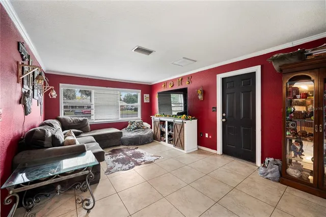 a living room with furniture and a window