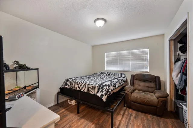 a bedroom with a bed and a couch