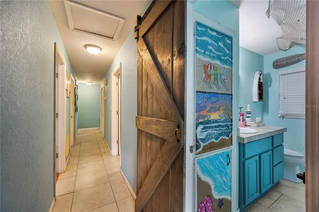 a bathroom with a sink vanity mirror and toilet