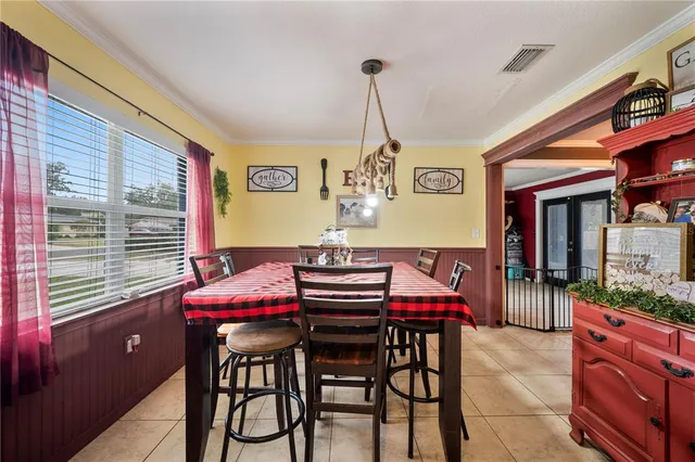 a dining room with furniture and window