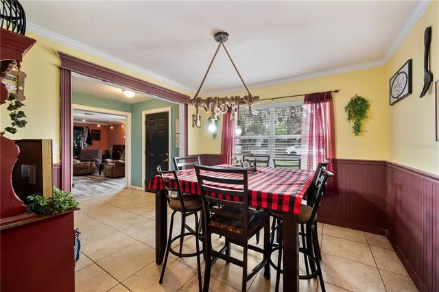 a dining room with furniture and window