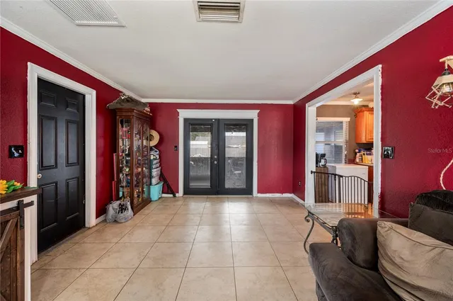 a view of a livingroom with furniture and closet