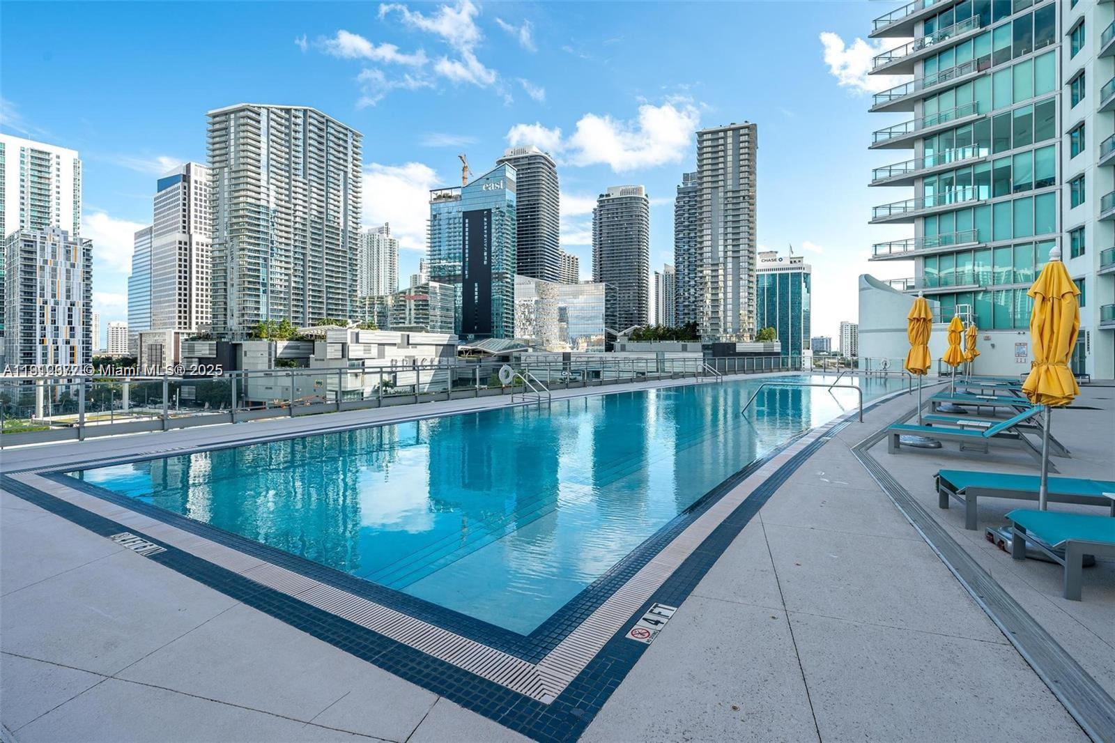 92 Southwest 3rd Street, Unit 4107 Miami, FL 33130 - Photo 23 of 30 a view of swimming pool with outdoor seating