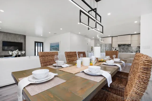 a kitchen with stainless steel appliances a sink stove and refrigerator