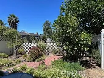 a front view of a house with trees