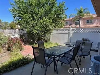 a bathroom with a shower and a plant