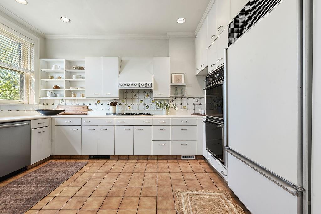 2057 Beechwood Boulevard Pittsburgh, PA 15217 - Photo 12 of 49 a kitchen with a sink a stove cabinets and counter space