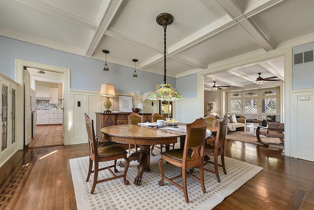 2057 Beechwood Boulevard Pittsburgh, PA 15217 - Photo 23 of 49 a dining room with furniture a chandelier and wooden floor