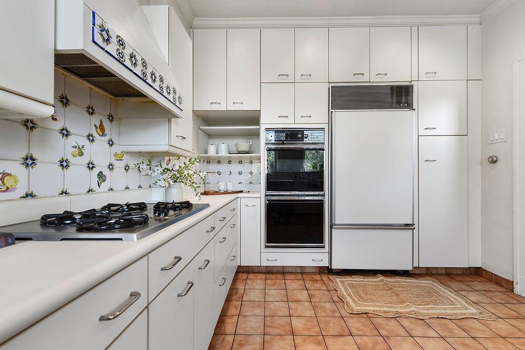 2057 Beechwood Boulevard Pittsburgh, PA 15217 - Photo 24 of 49 a kitchen with white cabinets and white appliances