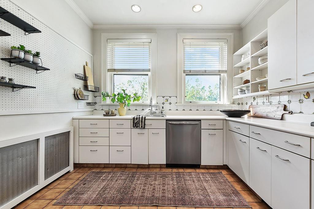 2057 Beechwood Boulevard Pittsburgh, PA 15217 - Photo 25 of 49 a kitchen with white cabinets window and sink