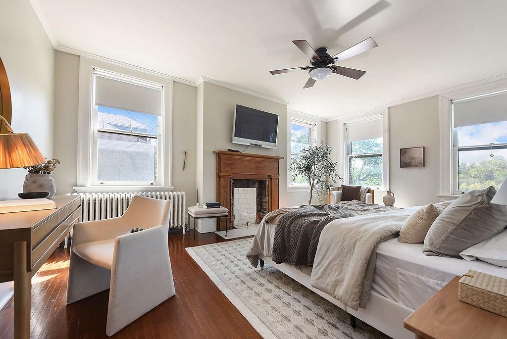 2057 Beechwood Boulevard Pittsburgh, PA 15217 - Photo 32 of 49 a bedroom with a bed and a fireplace