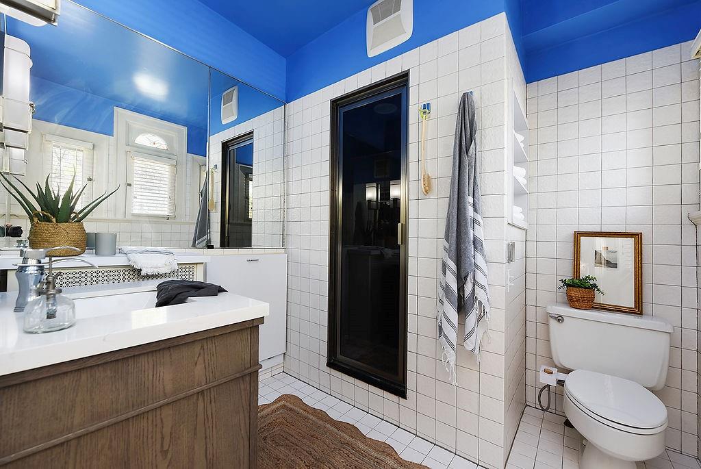 2057 Beechwood Boulevard Pittsburgh, PA 15217 - Photo 34 of 49 a bathroom with a sink a toilet a shower and a mirror