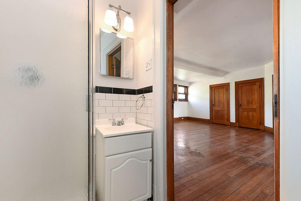 2057 Beechwood Boulevard Pittsburgh, PA 15217 - Photo 45 of 49 a bathroom with a sink and a mirror