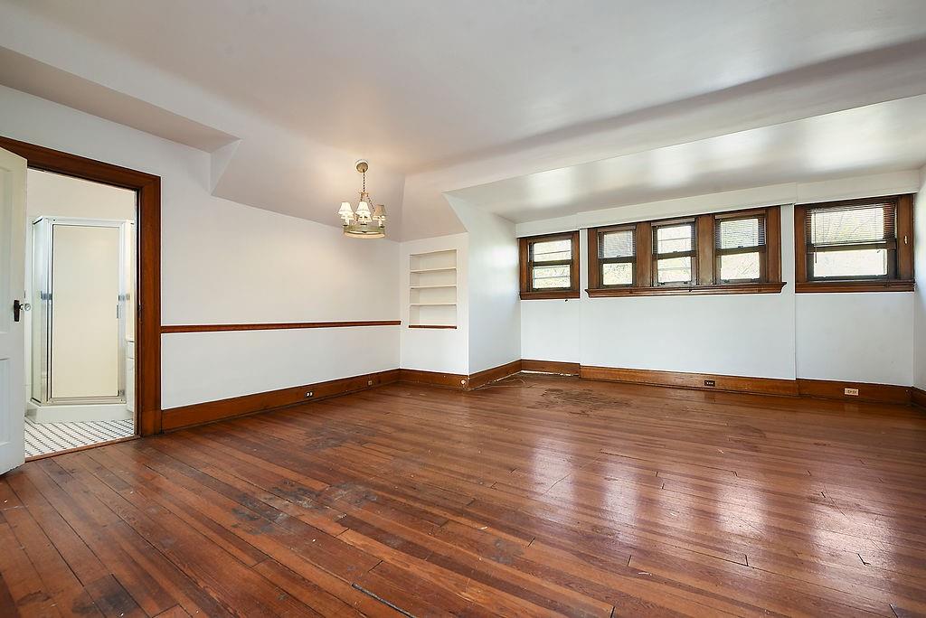 2057 Beechwood Boulevard Pittsburgh, PA 15217 - Photo 46 of 49 a view of an empty room with wooden floor and a window