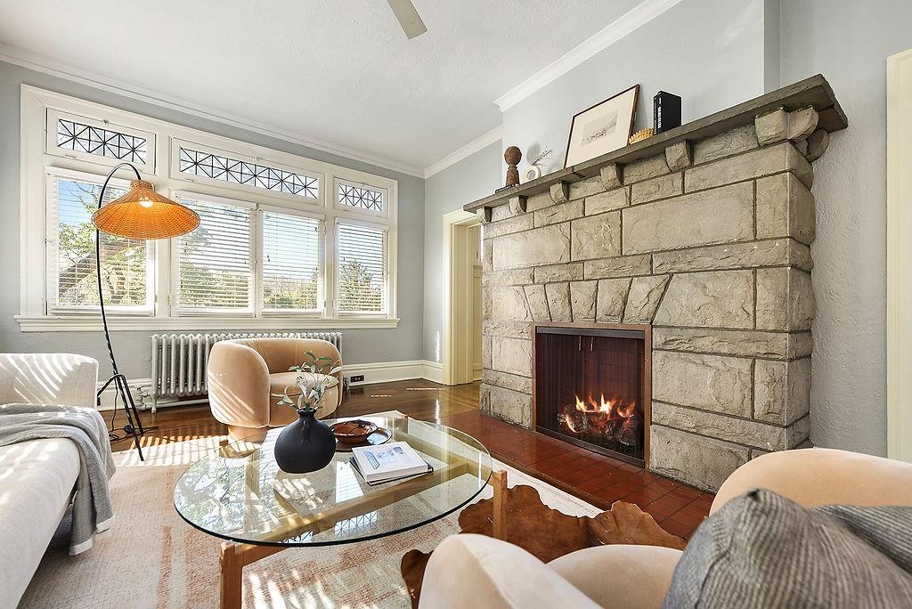 2057 Beechwood Boulevard Pittsburgh, PA 15217 - Photo 9 of 49 a living room with furniture a fireplace and a large window