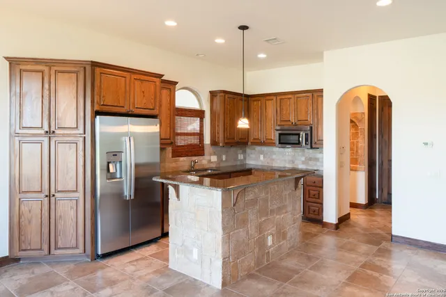a view of a livingroom with a kitchen