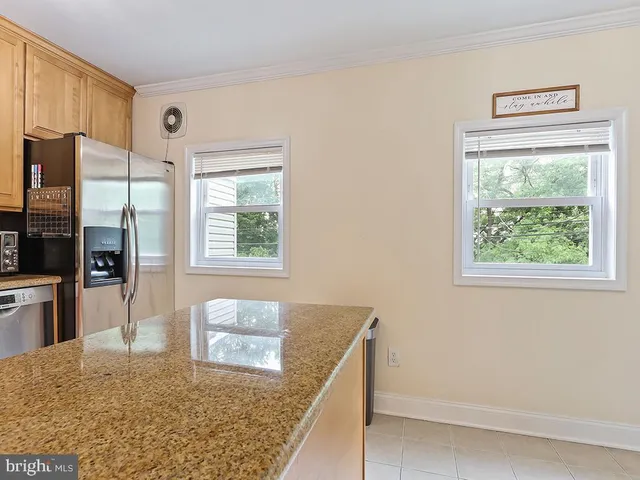 a view of a kitchen cabinets and a wooden floor