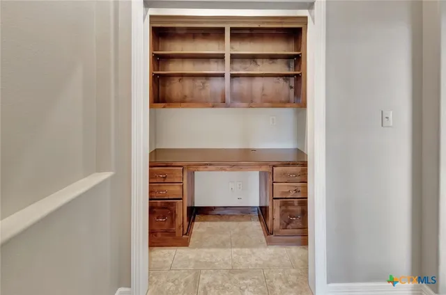 a view of an empty room and shelves