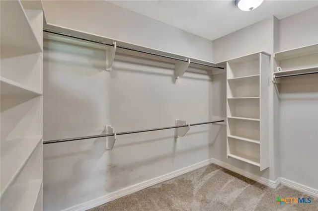 a view of an empty walk in closet