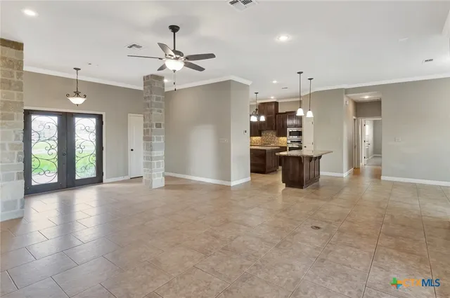 a view of a kitchen with a sink and a refrigerator