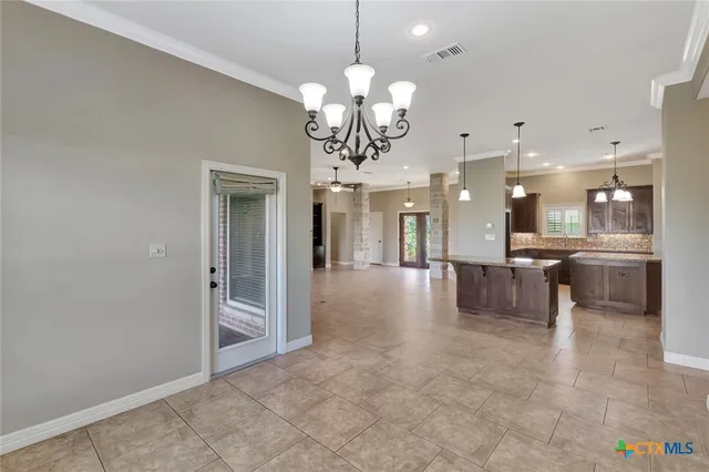 a view of a kitchen and a chandelier
