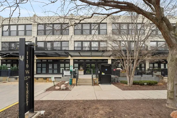 a view of a building with a tree