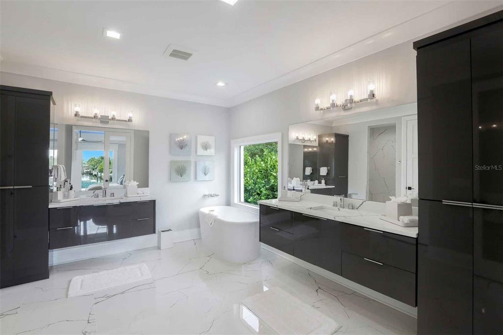 1608 Windmill Avenue Marco Island, FL 34145 - Photo 12 of 34 a large bathroom with a large tub and sink