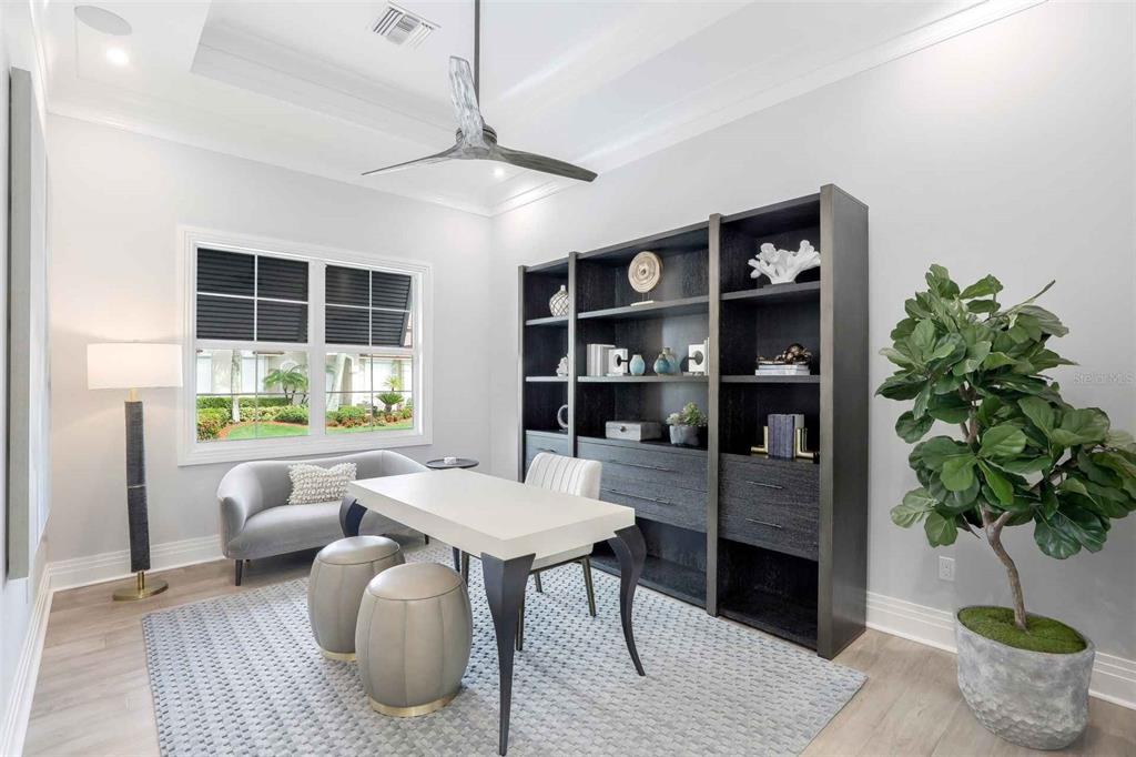 1608 Windmill Avenue Marco Island, FL 34145 - Photo 22 of 34 a living room with furniture and a potted plant