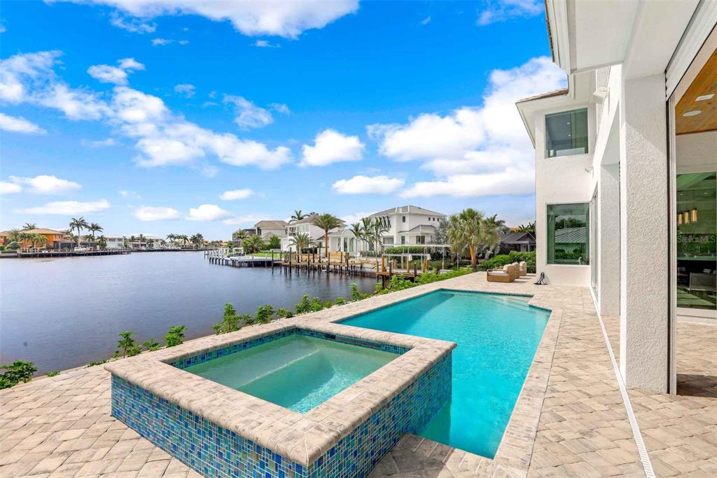 1608 Windmill Avenue Marco Island, FL 34145 - Photo 27 of 34 a view of a lake with couches chairs