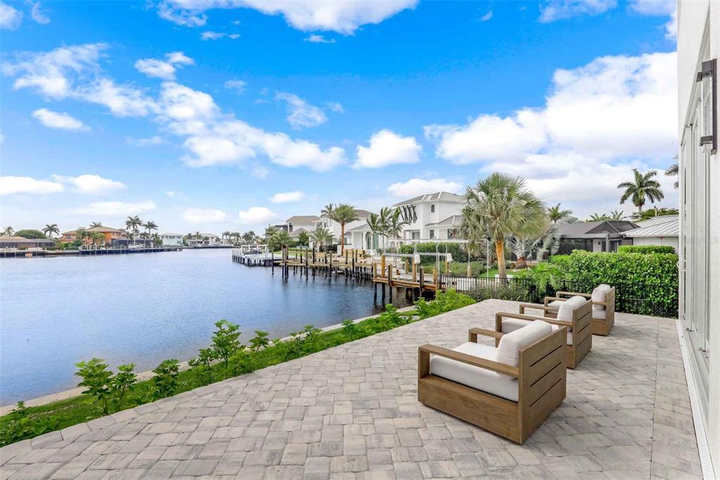 1608 Windmill Avenue Marco Island, FL 34145 - Photo 28 of 34 a view of a lake with couches and city view