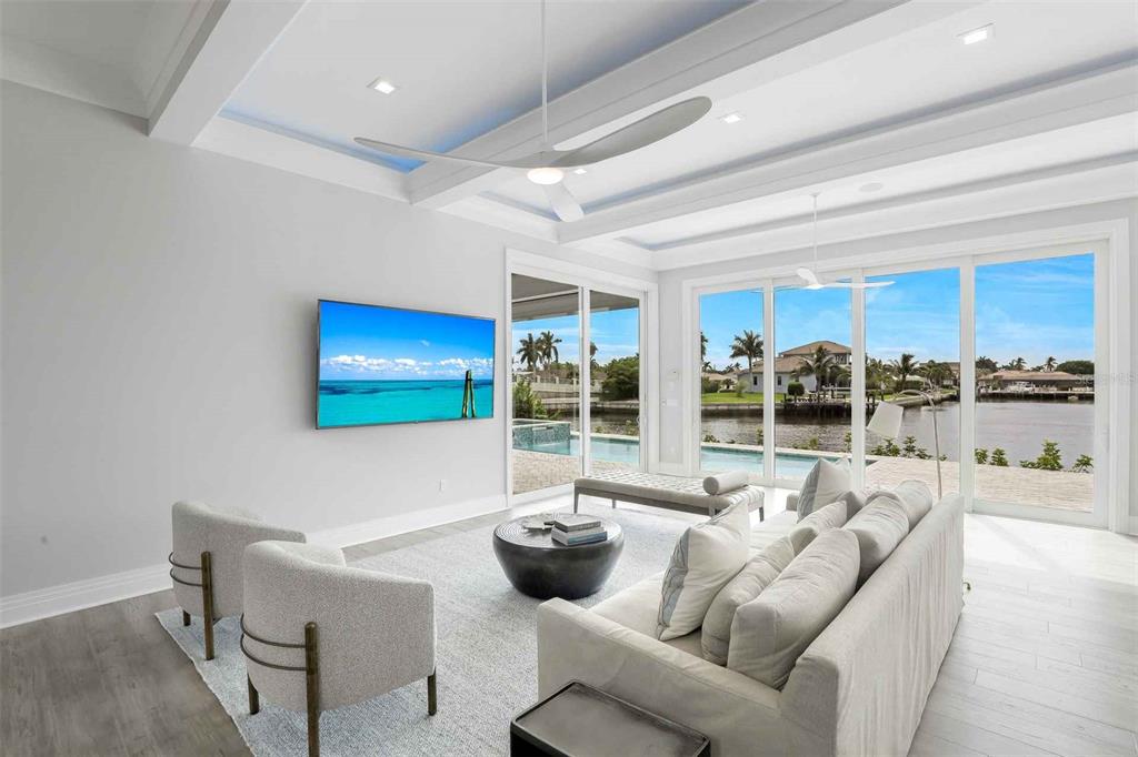 1608 Windmill Avenue Marco Island, FL 34145 - Photo 4 of 34 a living room with furniture and a large window