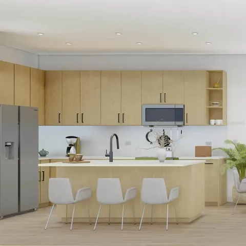 a kitchen with a dining table and chairs