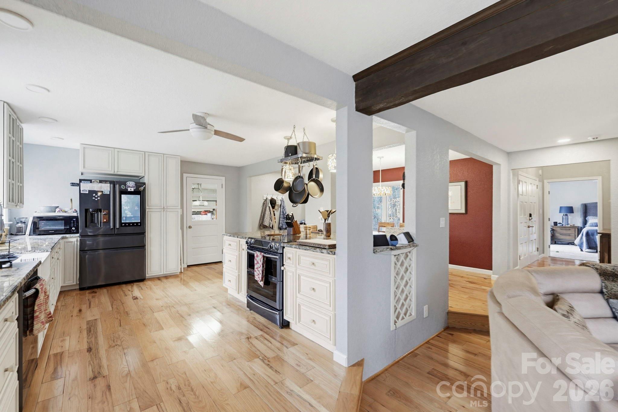 27 Spring Hill Circle Arden, NC 28704 - Photo 14 of 47 a view of a kitchen with refrigerator and wooden floor
