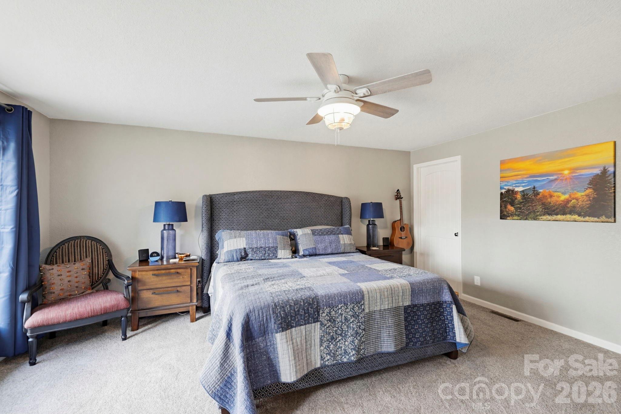 27 Spring Hill Circle Arden, NC 28704 - Photo 17 of 47 a bedroom with a bed and a painting on the wall