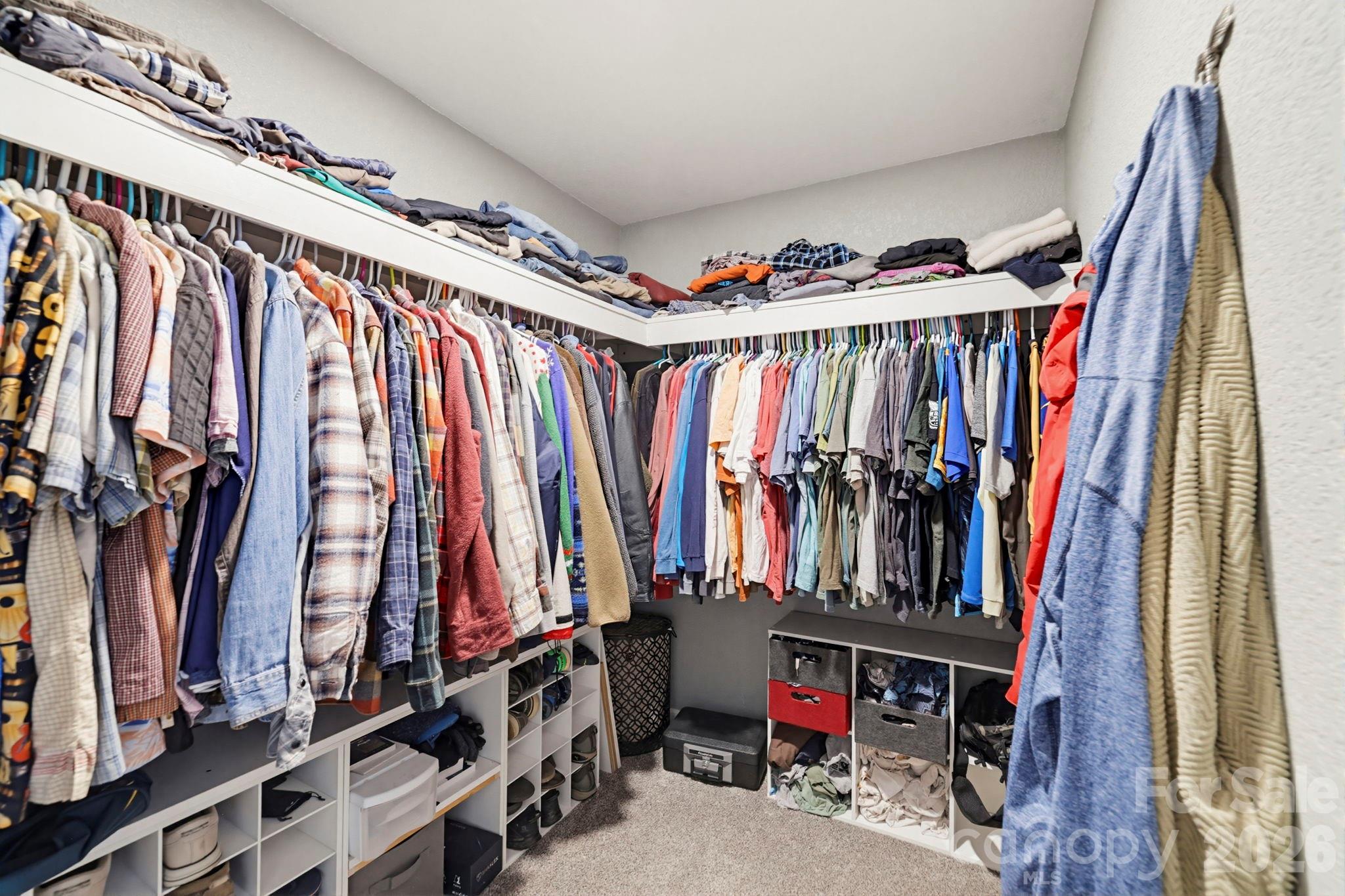 27 Spring Hill Circle Arden, NC 28704 - Photo 20 of 47 a view of walk in closet with clothes